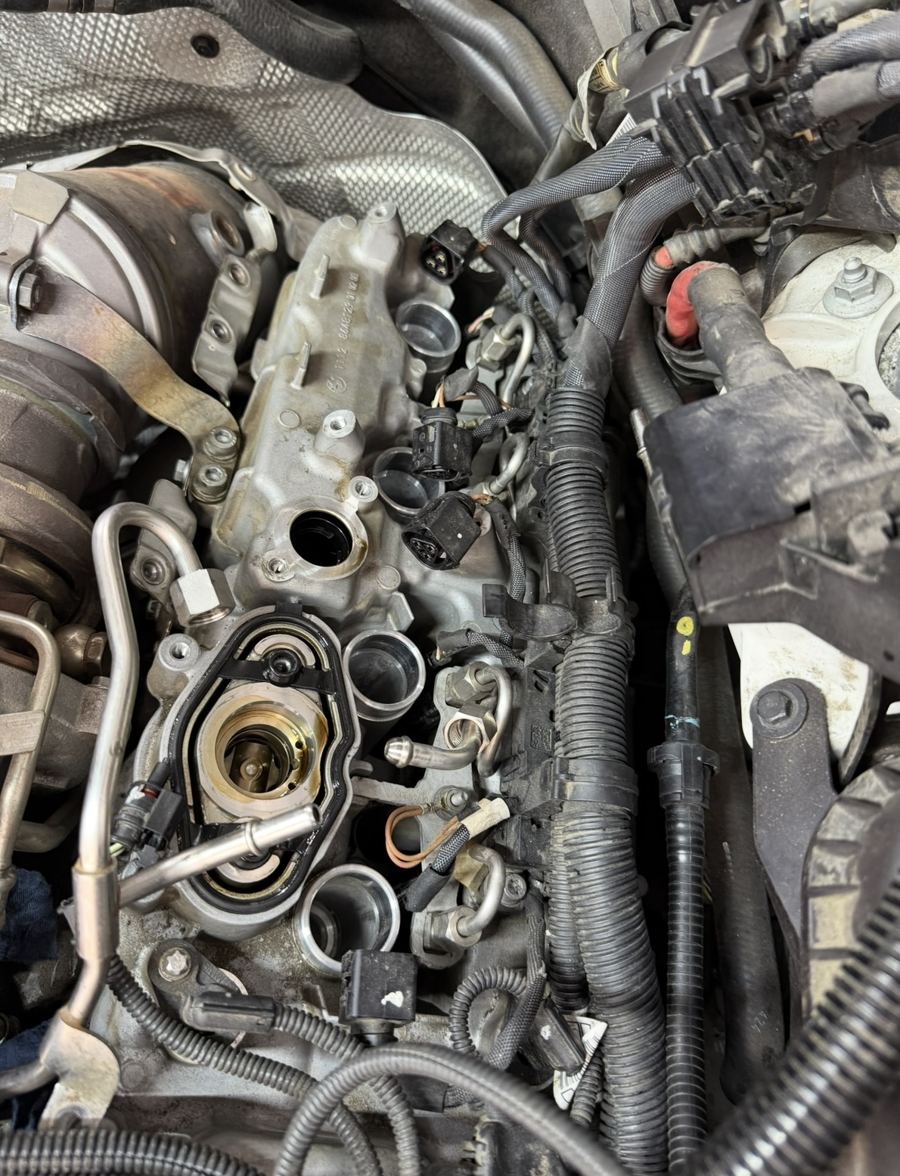 BMW B-series engine timing chain and VANOS units exposed during overhaul